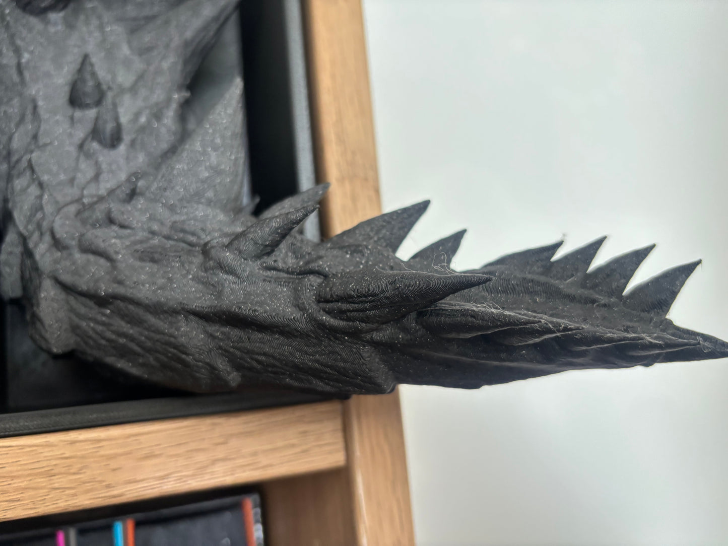 Space black emerging dragon book nook